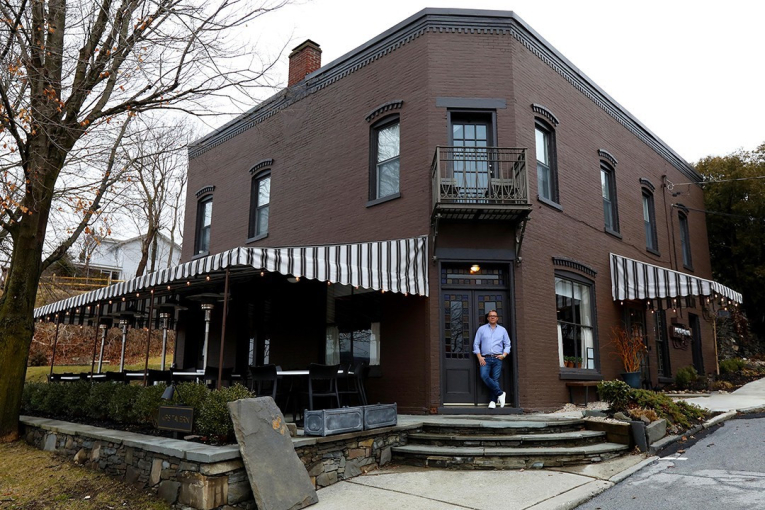 <p>Owner Christopher Dorsey in front of Kip&#39;s Tavern, which has a 28-seat patio overlooking the Hudson River.</p>